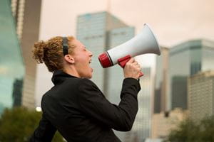 Woman letting the world know via megaphone